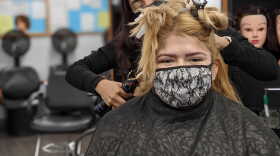  Johnston County Community College cosmetology student Rocio De Leon gets her hair curled during the class's salon hours.