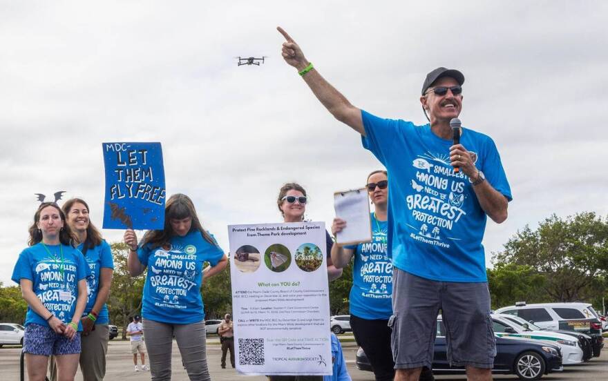 Ron Magill (far right), the communications director at Zoo Miami leads a group of South Florida residents during a rally to convince the Miami-Dade commission to vote against the controversial plan to build the Miami Wilds water park next to Zoo Miami, on Saturday, November 4, 2023.