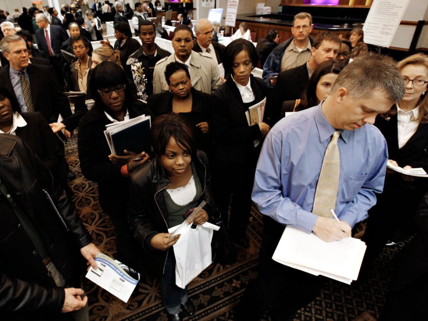 Job-seekers attend a job fair in Livonia, Mich., on Wednesday.
