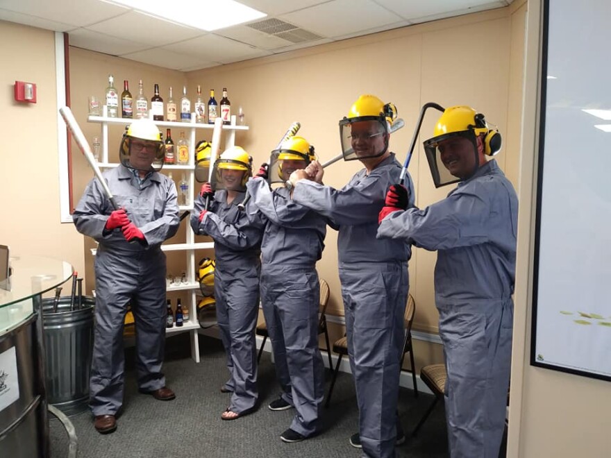 Participants are wearing their protective gear and ready for their smashing session.