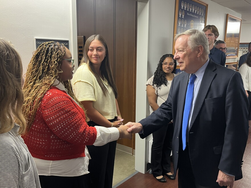 U.S. Senator Dick Durbin (on right) shakes hands with students at Illinois Wesleyan University.