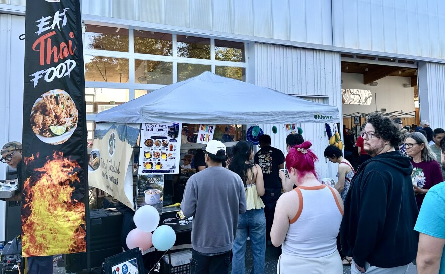 People outside food tent. 