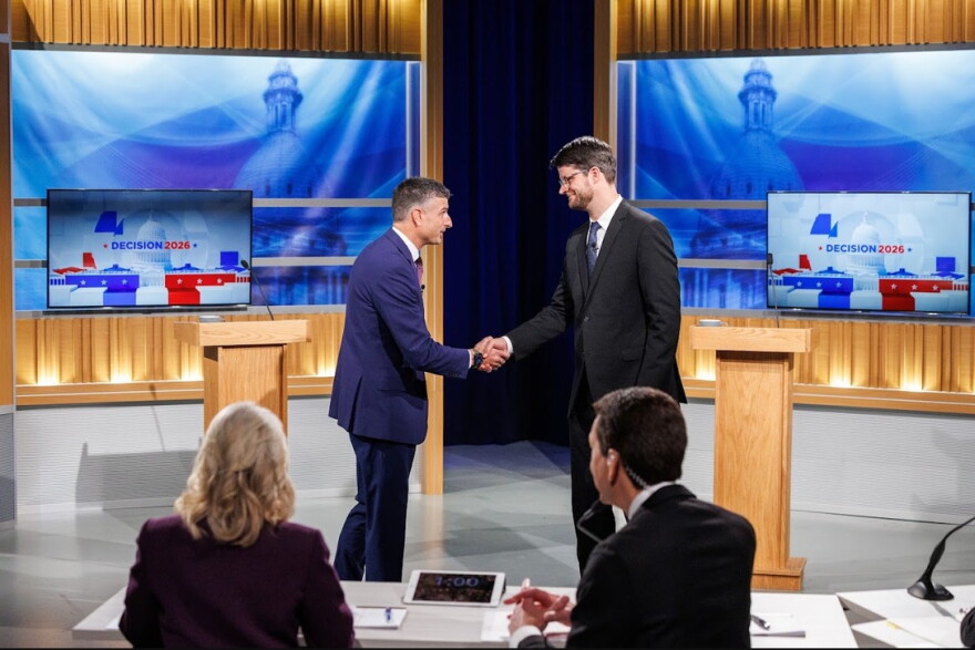 Republican Congressman Tom Barrett and Democratic challenger Will Lawrence prepare to debate.