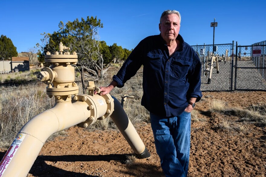 Lee Zlotoff stands next to an above-ground gas pipeline on the western edge of Eldorado. In his nightmare scenario, a wildfire would cause the line to explode.