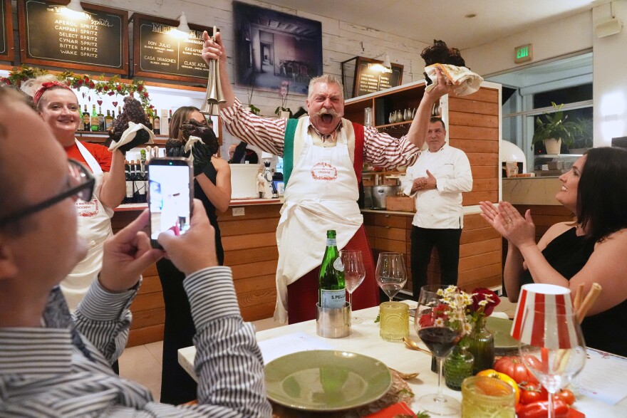 Butcher Dario Ceccini of Italy, welcomes guests to a private dinner at the South Beach Wine and Food Festival Saturday, Feb. 21, 2026, in Miami Beach, Fla. (AP Photo/Marta Lavandier)