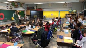 Milwaukee German Immersion third grade teacher Susan Richardson talks to students on their first day back in classrooms since March 2020.