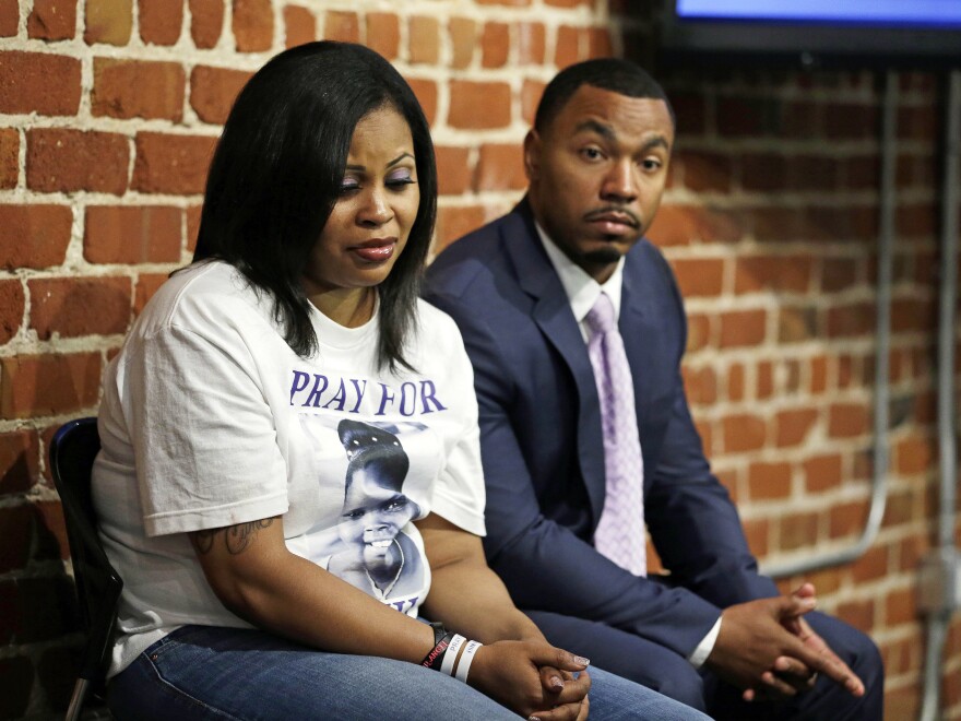 Nailah Winkfield (left) and Omari Sealey, the mother and uncle of Jahi McMath, listen to doctors speak during a news conference in San Francisco in 2014.
