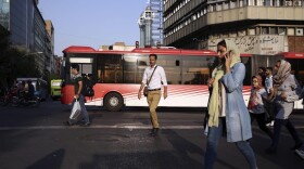 People cross Jomhouri-e-Eslami (Islamic Republic) St. in downtown Tehran, Iran, Monday, July 30, 2018. Iran's currency plummeted to a record low Monday, a week before the United States restores sanctions lifted under the unraveling nuclear deal, giving rise to fears of prolonged economic suffering and further civil unrest. (Vahid Salemi/AP)