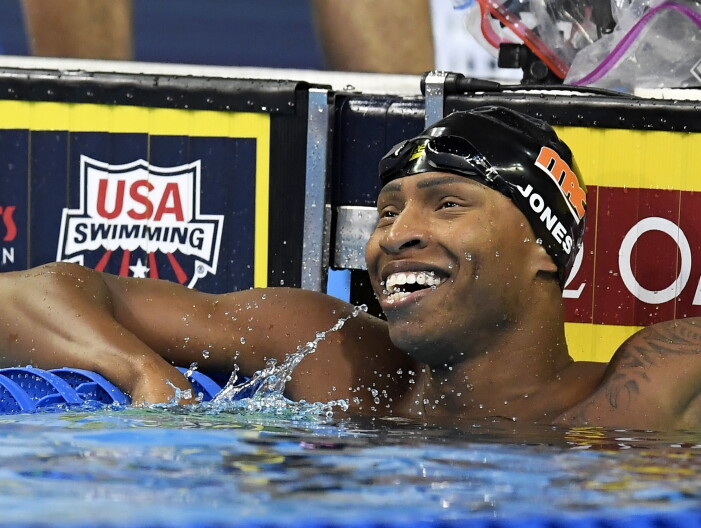Cullen Jones smiles after his heat in the men's 50-meter freestyle semifinal at the U.S. Olympic swimming trials in Omaha, Neb.