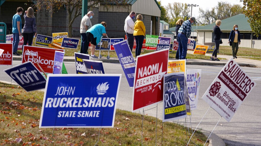 Voters wait in line to cast their ballot in the 2020 Presidential election during early voting in Noblesville, Ind.Wednesday, Oct. 14, 2020.