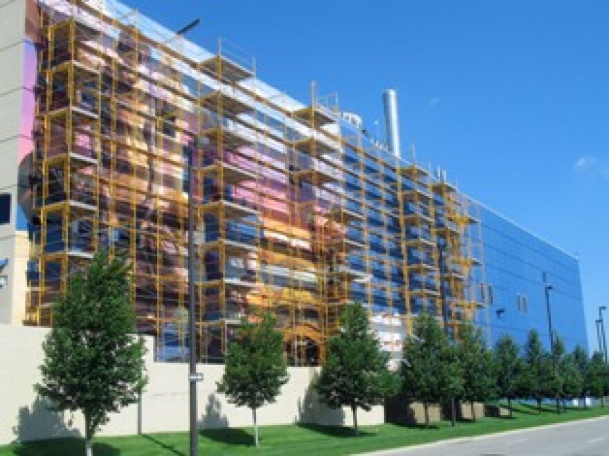Artist Meg Saligman and her team work on the Fertile Ground mural project in downtown Omaha.
