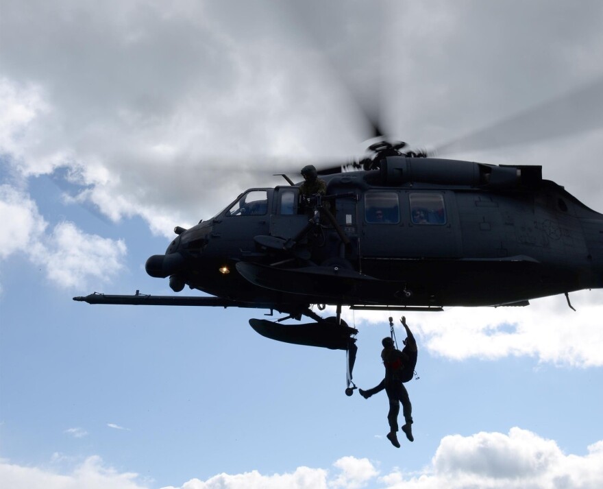 Members of the Alaska Air National Guard's 176th Wing on Monday night hoisted the stranded snowmachine riders into a HH-60 Pave Hawk helicopter hovering over the College Glacier in the Eastern Alaska Range. It's the same method they used to rescue an injured hunter on Sept. 8 from a remote area about 285 miles northwest of Anchorage, as shown here.