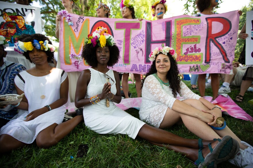 Sanam Emami (right), with fellow Omi Collective members, is originally from Iran and says the tension in the immigration debate is rooted in a "detachment to the mother."