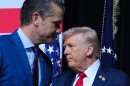 President Donald Trump is greeted by Secretary of Defense Pete Hegseth