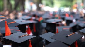 A group of graduates during a commencement ceremony.