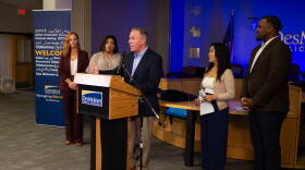 Members of the Des Moines School Board congratulate interim superintendent Matt Smith, who they just named permanent superintendent.