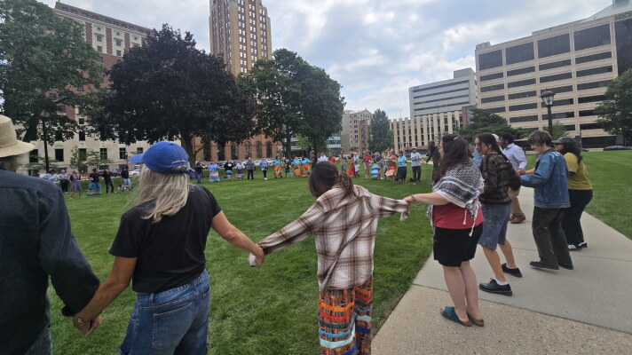 Activists, including tribal community members, opposed to the operation of the Line 5 oil and natural gas liquids pipeline, rally at the Michigan Capitol on Wednesday, August 27.