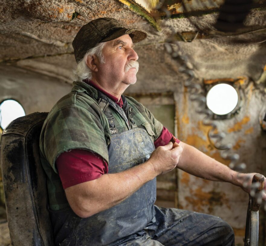 Fisherman sitting on his boat.