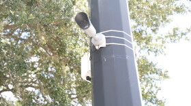 A camera sits on a pole in Gainesville.
