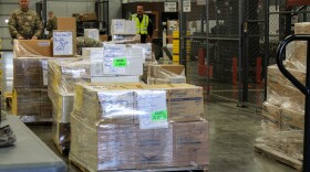 Members of the Indiana National Guard load and sort supplies from the Strategic National Stockpile to deliver to hospitals across the state.