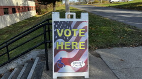 A directional Vote Here sign positioned outside a polling location in Central New York.