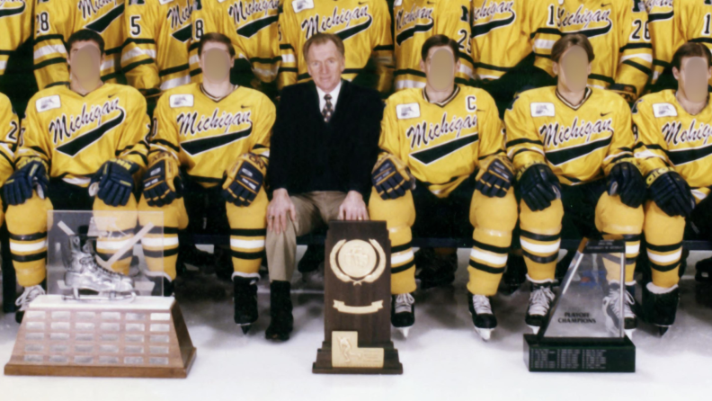 The 1996 University of Michigan men's ice hockey team, posed with trophies.