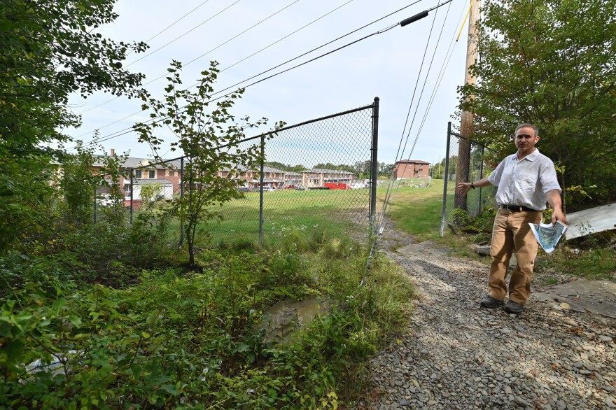 Valley in Motion President Gus Fahey stands near an area where Connell Park's trails in Scranton open to Valley View Terrace — and the potential spot for a new trail into the Pinchot State Forest.