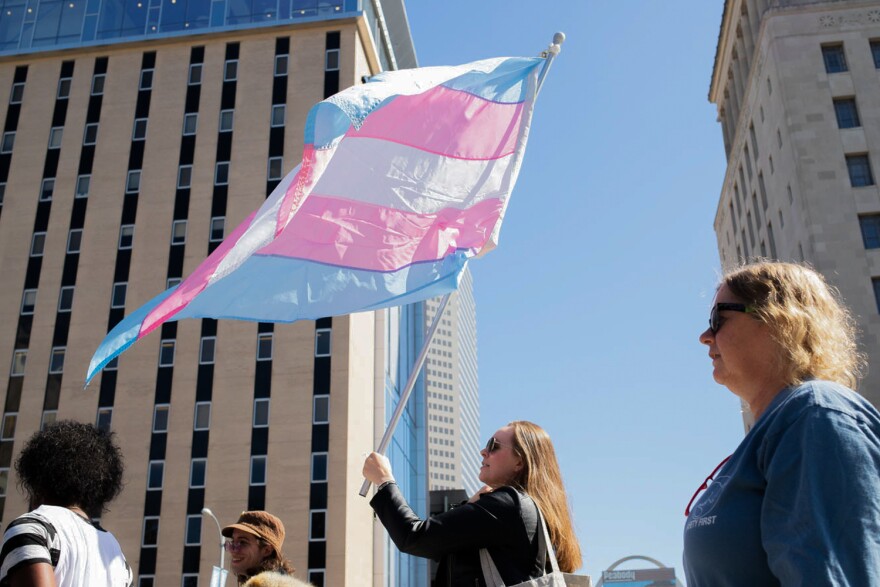 Protesters marched through downtown St. Louis on Sunday to protest ongoing U.S. Supreme Court cases that could leave LGBTQ workers in Missouri with few laws protecting them against discrimination.