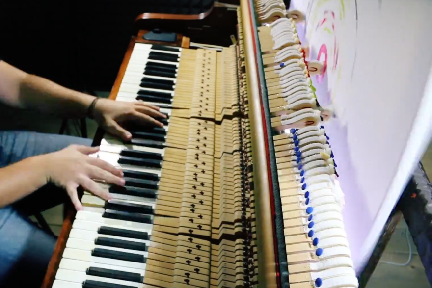 Francesco Maria Mancarella plays his piano that paints