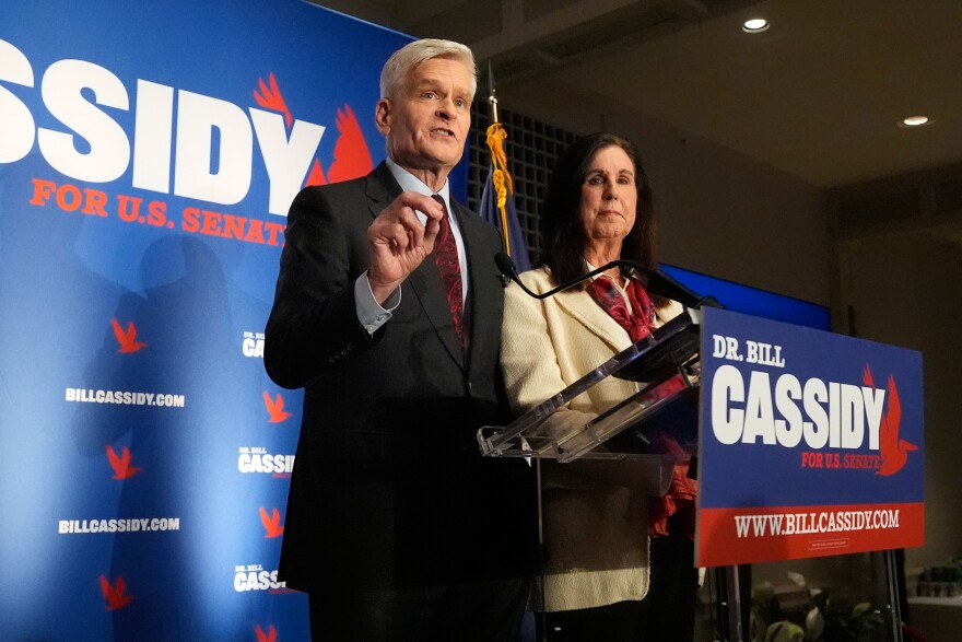 Sen. Bill Cassidy, R-La., left, speaks to supporters alongside his wife, Laura, during an election night watch party Saturday, May 16, 2026, in Baton Rouge, La.