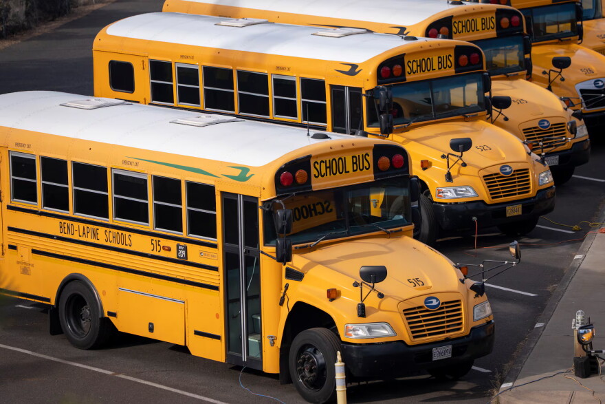 School buses are parked at Bend-La Pine Schools Transportation facility on Oct. 18, 2026, in Bend, Ore.