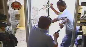 Video released by police show the confrontation between Lakeland City Commissioner Michael Dunn and Christobal Lopez, which ended in Lopez's death outside of Dunn's Army & Navy Surplus store.
