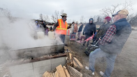 A demonstration at Maplewood State Park's Maple Syrup Day shows guests the boiling-down processing of maple syrup.