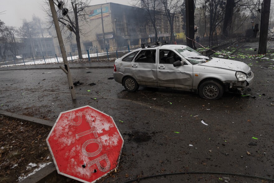 Rubble and a damaged vehicle is seen across the street from the Kyiv TV Tower on Wednesday.