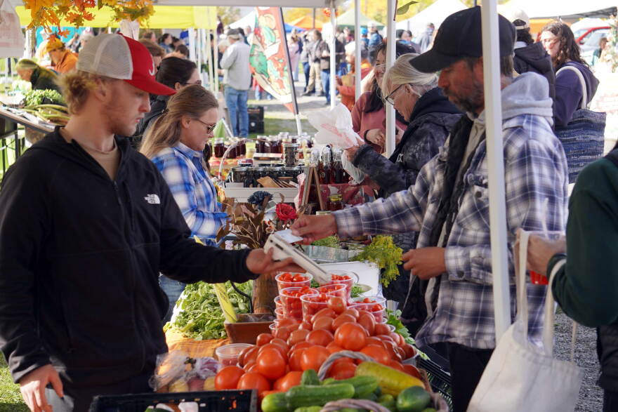 Attendees browse booths filled with fruits and vegetables during the Harvest Moon Local Food Festival at Soldotna Creek Park in Soldotna, Alaska, on Saturday, Sept. 26, 2026.