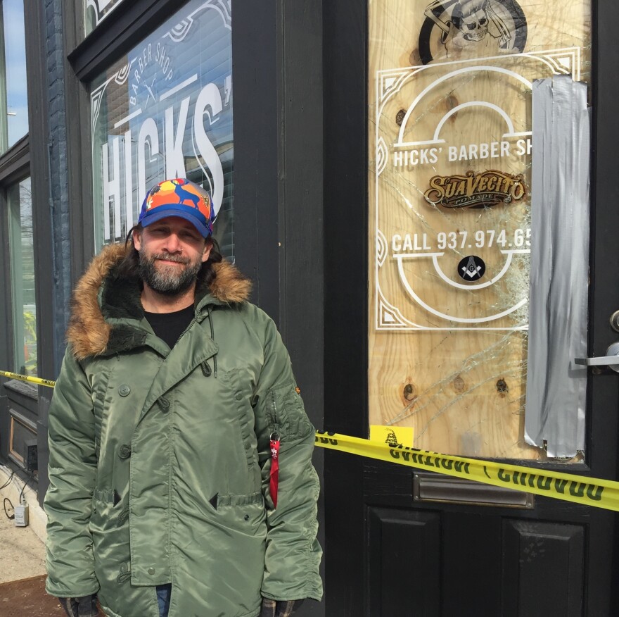 James Hicks stands in front of his business, which could remain closed for several months.