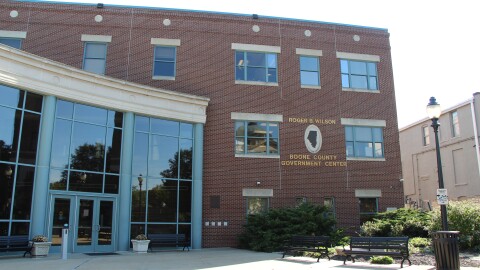 a wide shot of the exterior of the red brick Boone County government building