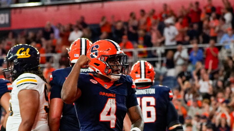 Syracuse running back Ju’Juan Johnson (4, Navy) celebrates in the end zone following his first score of the year.