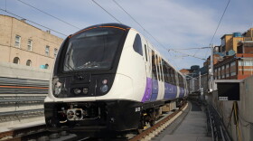 An Elizabeth Line test train passes through Custom House station in April 2018. (Courtesy of Crossrail)