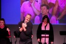 Bill Ebbesmeyer, performing the song "Hoosier Boy" from "Some of my best friends are" on October 20, in front of a screen showing his 1989 performance of the same song. 