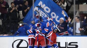 The New York Rangers celebrate a goal by Alexis Lafreniere during the third period of an NHL hockey game against the Minnesota Wild, Thursday, Nov. 9, 2023, in New York. (AP Photo/Frank Franklin II)