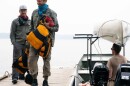 Brothers John Connelly, left, and Tom Connelly after they evacuated the Boundary Waters Canoe Area Wilderness with the help of tow boat driver Willy Vosburgh on Thursday at Moose Lake near Ely, Minn. | MPR