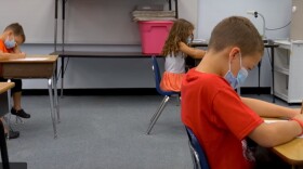 A video by Hernando County Schools shows children wearing masks with desks spaced six feet apart