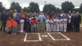 Marion County officials and community leaders join with team players and parents to celebrate the World Series tournament returning to Ocala. (Alcino N. Donadel/WUFT News)