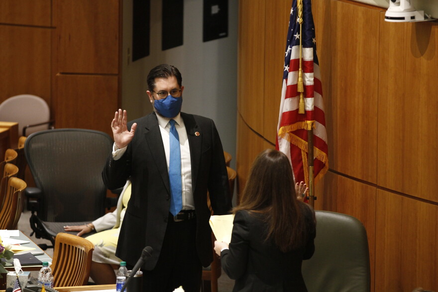 FILE - State House Majority Speaker Brian Egolf takes his oath on the opening day of the legislative session on Tuesday, Jan. 19, 2021, in Santa Fe, N.M. Top Democrats in the New Mexico House have chosen to dissolve a legislative committee that deals with Hispanic land grants, traditional irrigation districts known as acequias and other local government and cultural affairs. The recent decision announced by House Speaker Brian Egolf is spurring criticism from Hispanic lawmakers, including two members of New Mexico's congressional delegation. (AP Photo/Cedar Attanasio, File)