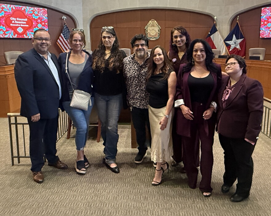 Supporters and friends of Erica Andrews pose for a photo after city council approval of the memorial ways designation on Thursday
