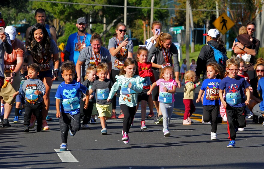 The kids take off from the starting line in Orlando in Track Shack's Seniors First Turkey Trot 5K fun run.