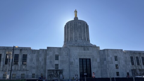 The Oregon Capitol. Construction equipment and fencing is seen in the foreground. 