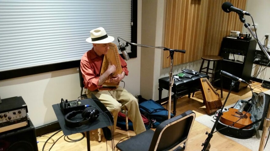 Folk singer Adam Miller performs on the autoharp in Studio A