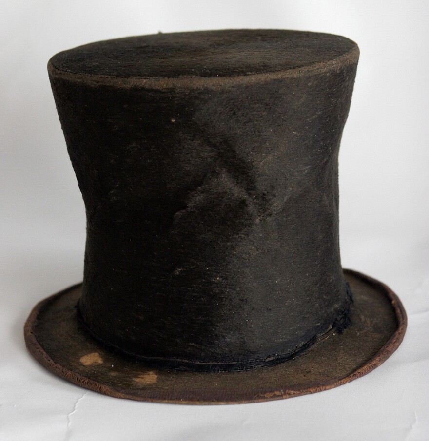 FILE - In this June 14, 2007, file photo, Abraham Lincoln's iconic stovepipe hat of questioned authenticity is photographed at the Abraham Lincoln Presidential Library and Museum in Springfield, Ill. Now that there is no concrete evidence that the felted beaver-fur hat ever sat atop Lincoln's 6-foot-4 frame, the foundation that bought the hat as part of a 1,500-piece, $23 million deal with California collector Louise Taper is not considering asking for a refund. (AP Photo/Seth Perlman File)